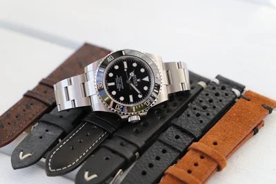 An automatic watch with various wristlet colors.