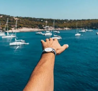 A Timex Adventure Watch worn by a person while at sea.