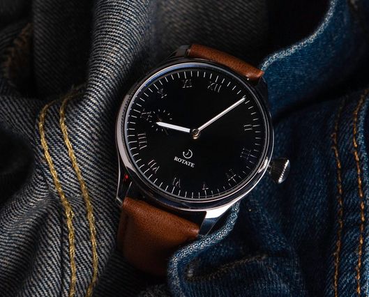 minimalist watch placed on a denim cloth.