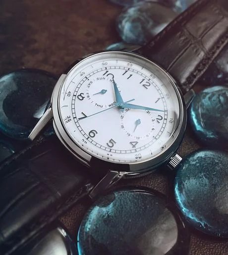 Wenger field watch with black leather wristband.